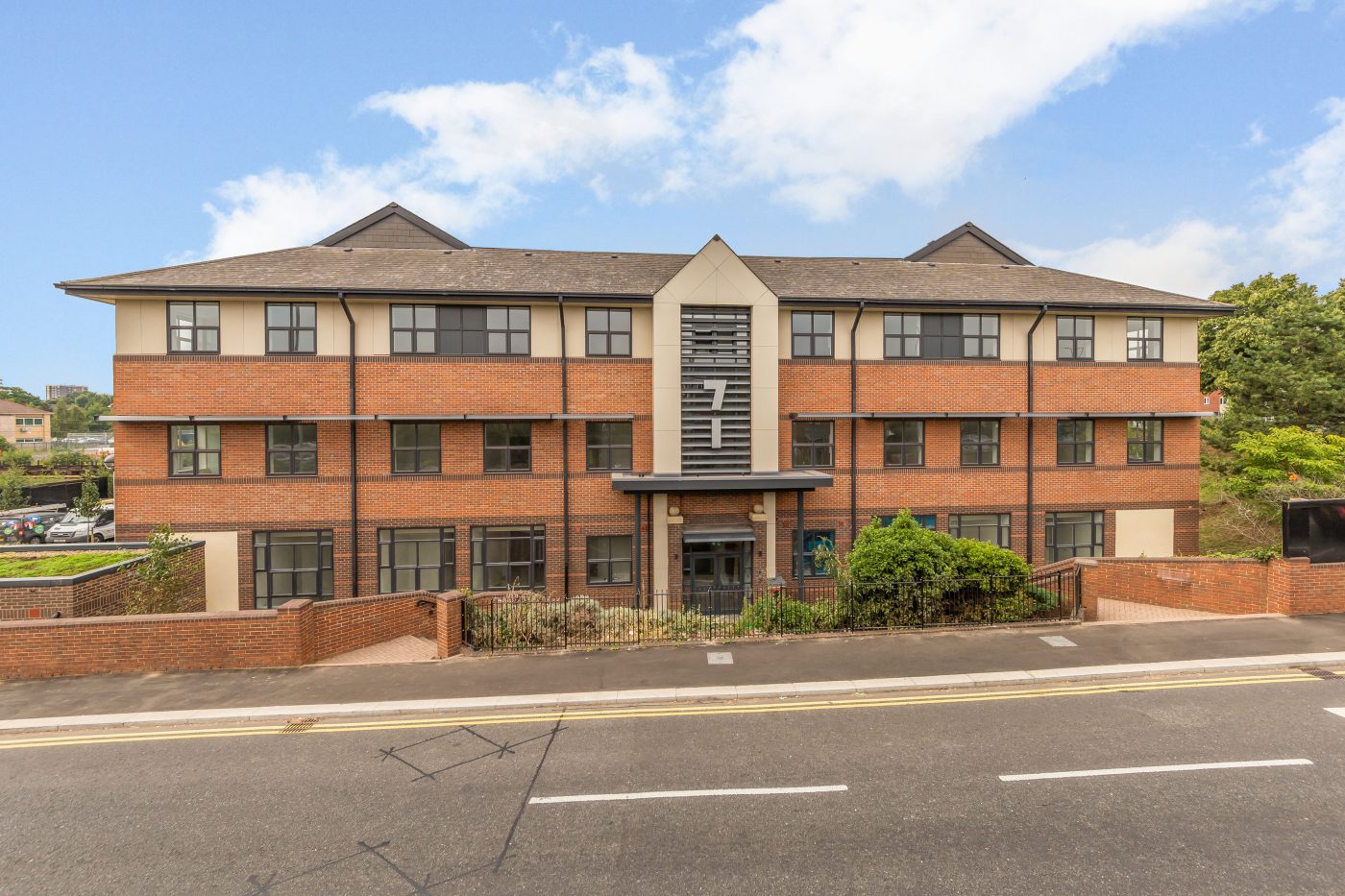 Brick apartment building with a central entrance