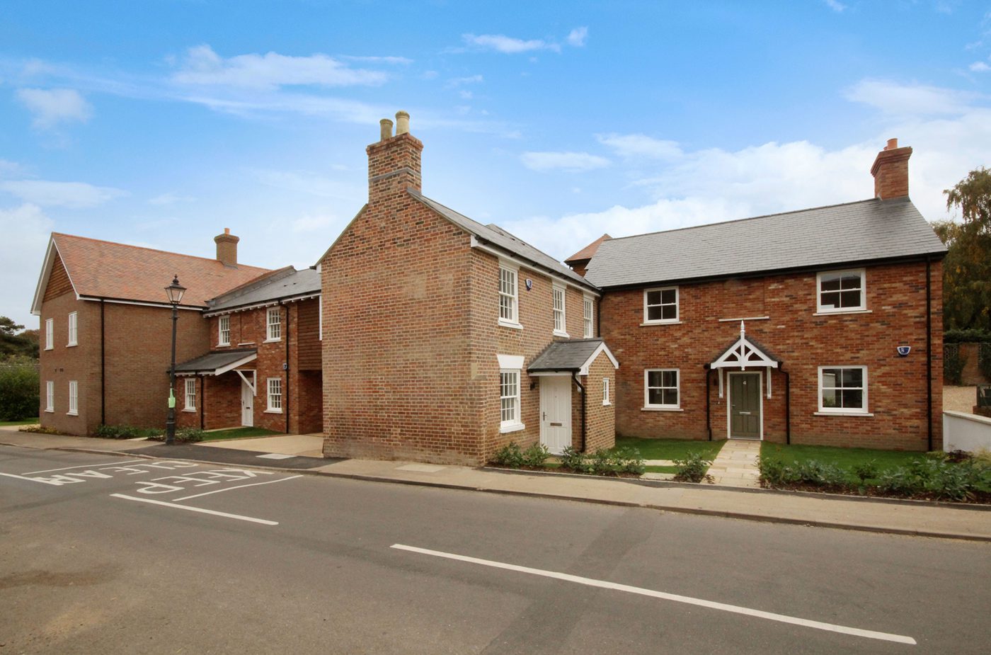 New brick cottages on a village street