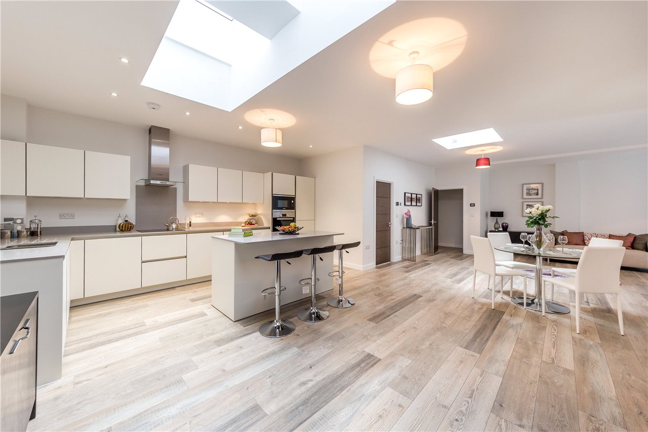 Open-plan kitchen and dining room with rooflights